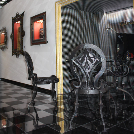 Table and chairs made wrought iron and glass