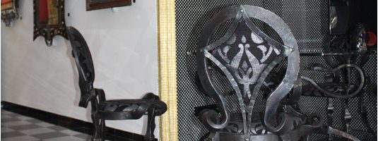 Table and chairs made wrought iron and glass